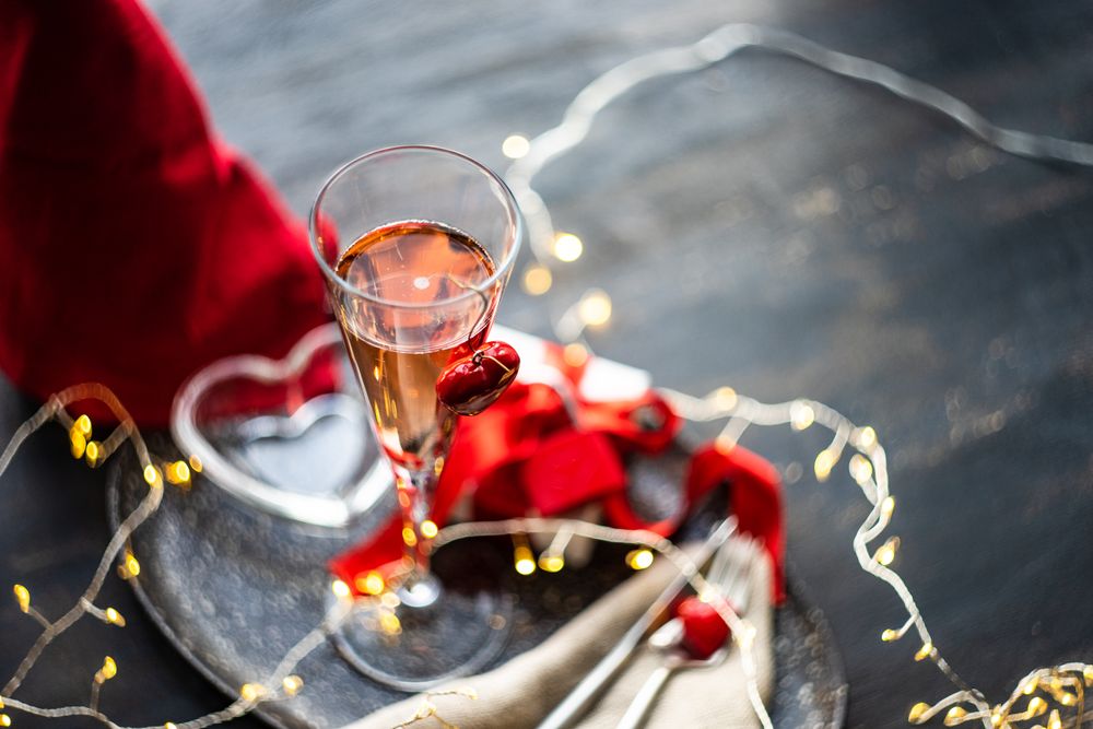 Champagne on trey with gift & silverware with fairy lights