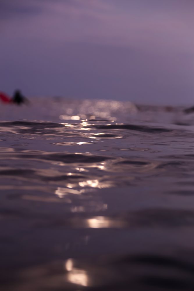 Water wave and cloudy sky