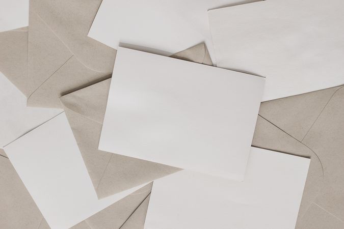 Set of blank letters with craft envelopes on table