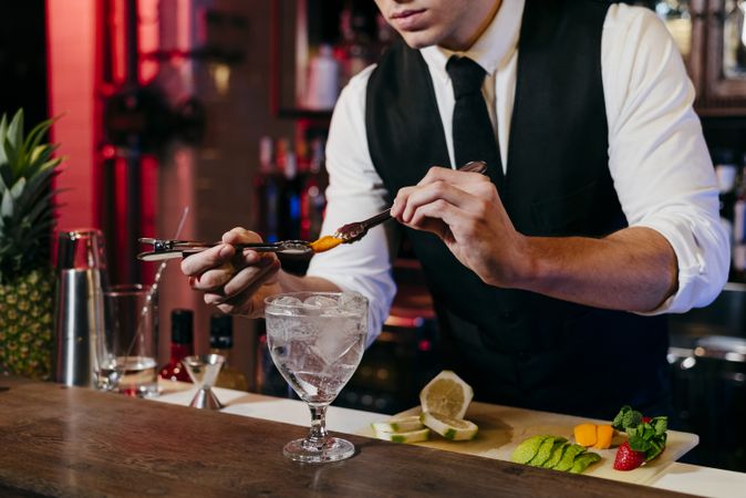 Barman working making drinks