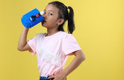 Asian Girl Kids Drink Water from Blue Cute Cup