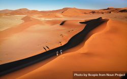 Two people walking on desert in Namib, Erongo, Namibia 4jAlz5