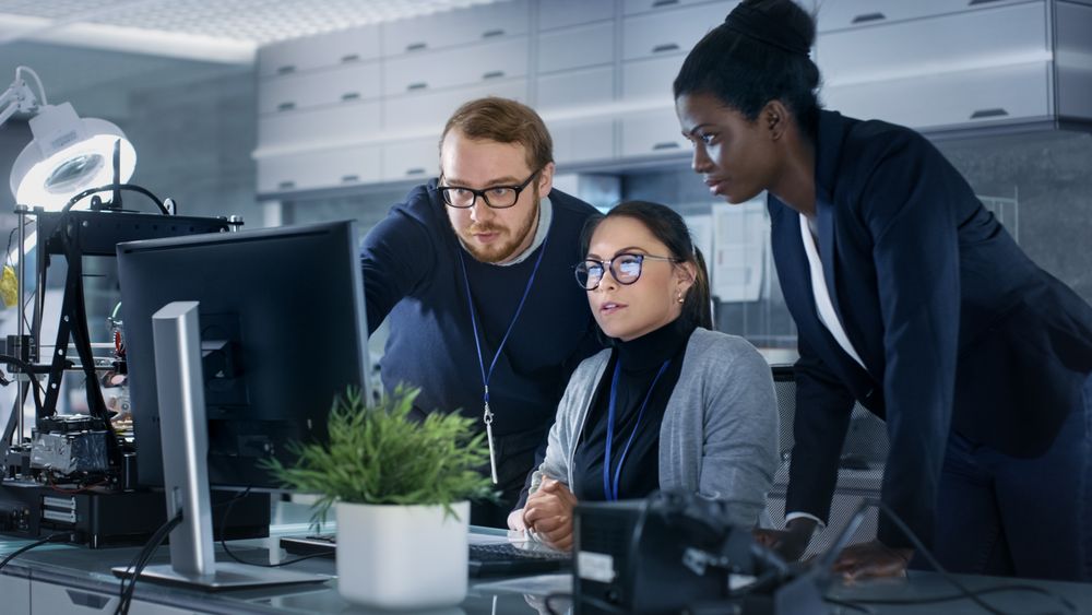 Diverse Team of Research Engineers Working in a high Tech Laboratory on a High Profile Start-up.