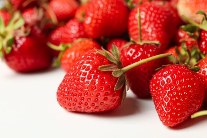 Tasty red strawberry on plain background, close up. Summer berry