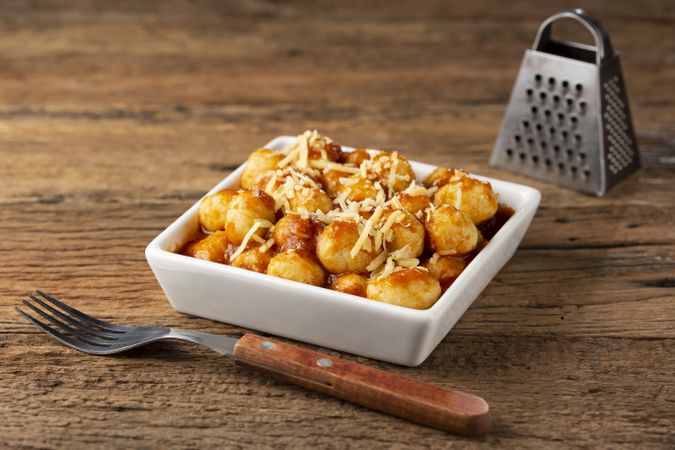 Gnocchi with tomato sauce and grated Parmesan cheese.