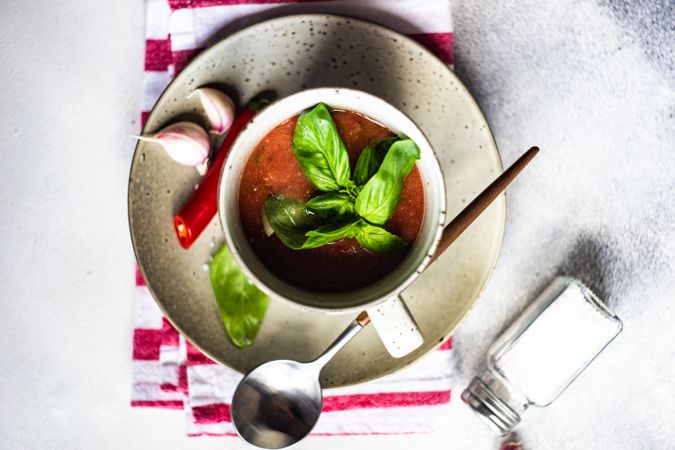 Top view of traditional gazpacho soup with basil, garlic and pepper
