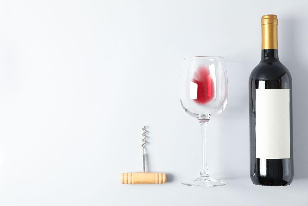 Flat lay composition with corkscrew, bottle and glass with wine, copy space