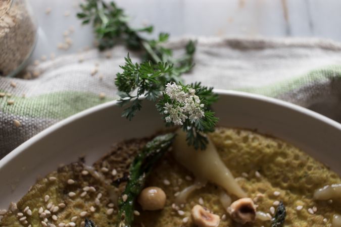 Served vegetarian crepe with oats and asparagus