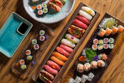 Various sushi on wooden table