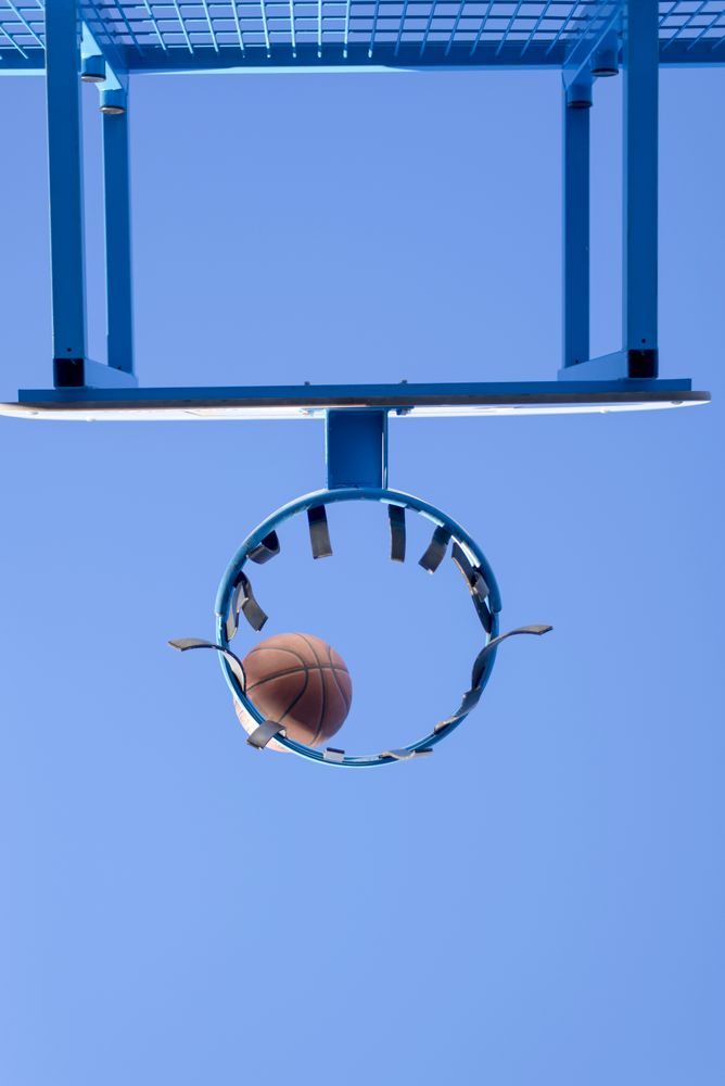 Basketball going into the net, point scored