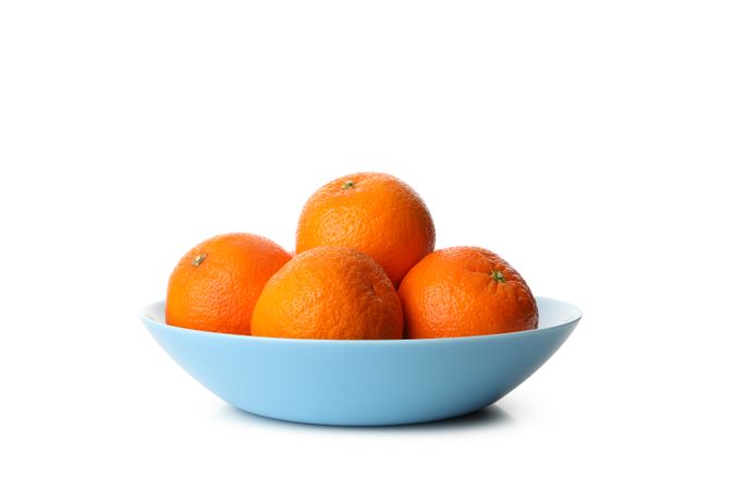 Plate with ripe mandarins isolated on light background