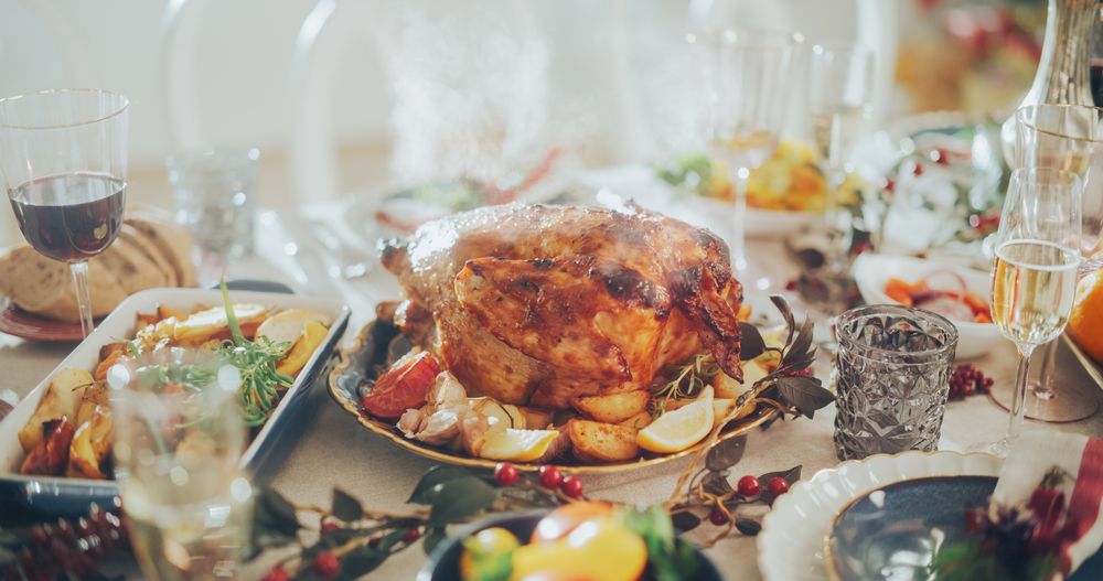 Delicious Close Up of a Turkey Roast with Baked Potatoes on a Festive Table.