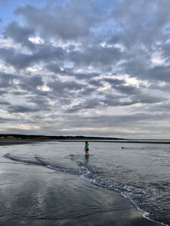 Woman walking on seashore