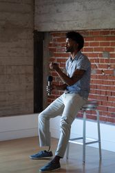 Man with prosthetic leg speaking at conference