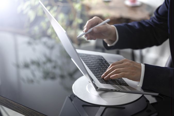 Businessman Working on Laptop at Office Desk