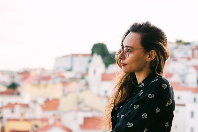 Casual woman against cityscape