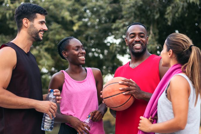 Team Spirit: Multiracial Friends Chatting and Bonding After a Fun Basketball Game