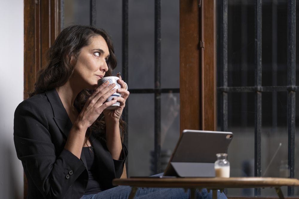Young female using digital tablet in cafe