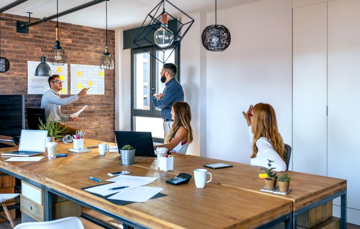 Team leader organizing work in an office