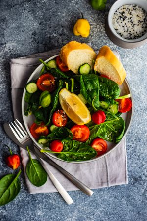 Fresh organic salad with spinach served with bread