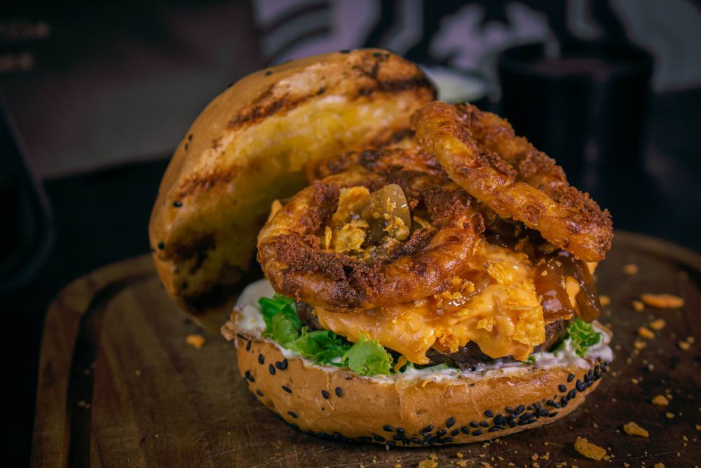 Delicious pub burger with onion rings