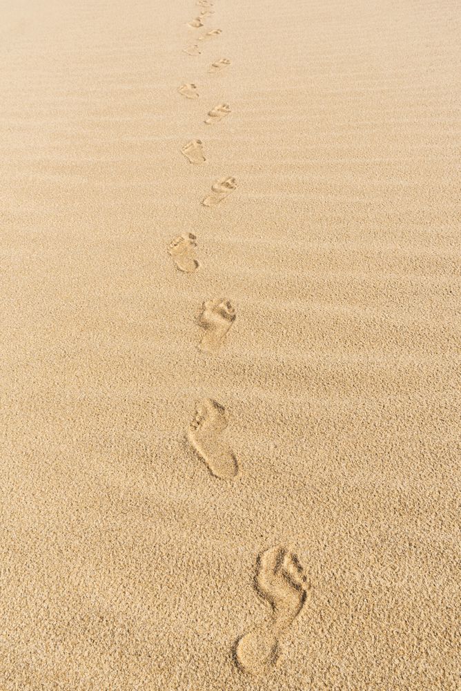 Footsteps on yellow sand