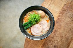 bowl with ramen soup in cafe