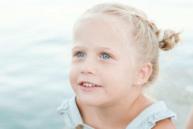 Charming girl against sea at beach