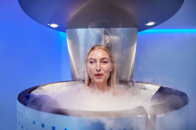 Blonde female in cryotherapy chamber