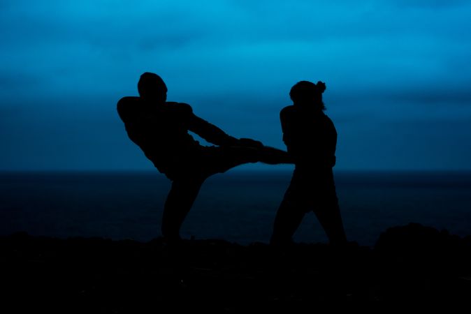 Anonymous kickboxers fighting at night