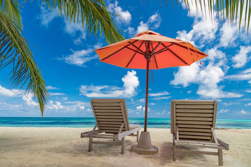 Beach lounge chairs on a tropical island, landscape