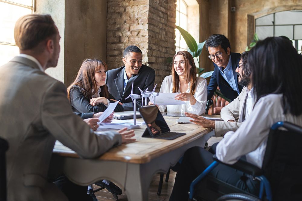 Group of multi-ethnic businesspeople discussing strategy around the table