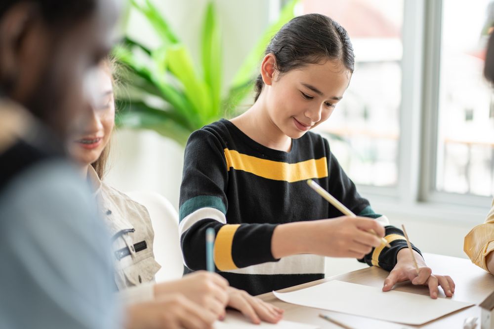 Young student writing class