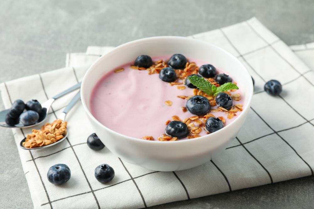 Composition with tasty yogurt on grey background, space for text