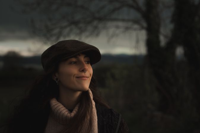 Young woman in warm clothes in forest