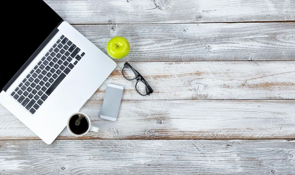 Fruit and coffee on working desktop