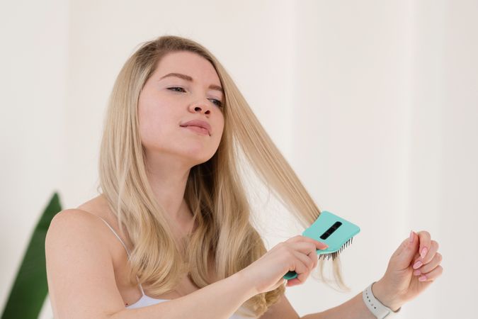Hair brushing as part of morning routine.