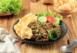 Plate of lotek, Sudanese vegetable salad with peanut dressing