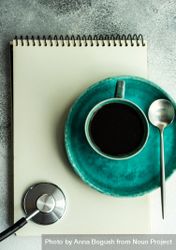 Top view of coffee cup with stethoscope and notepad 0WOP6p