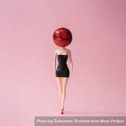 Barbie like doll in dark dress with red disco ball head with pink background 41R6Nb