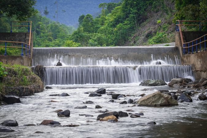 slow shutter speed of clear dam river water in jungle