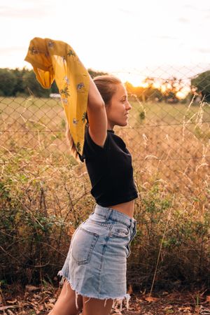 Happy female on meadow in summer
