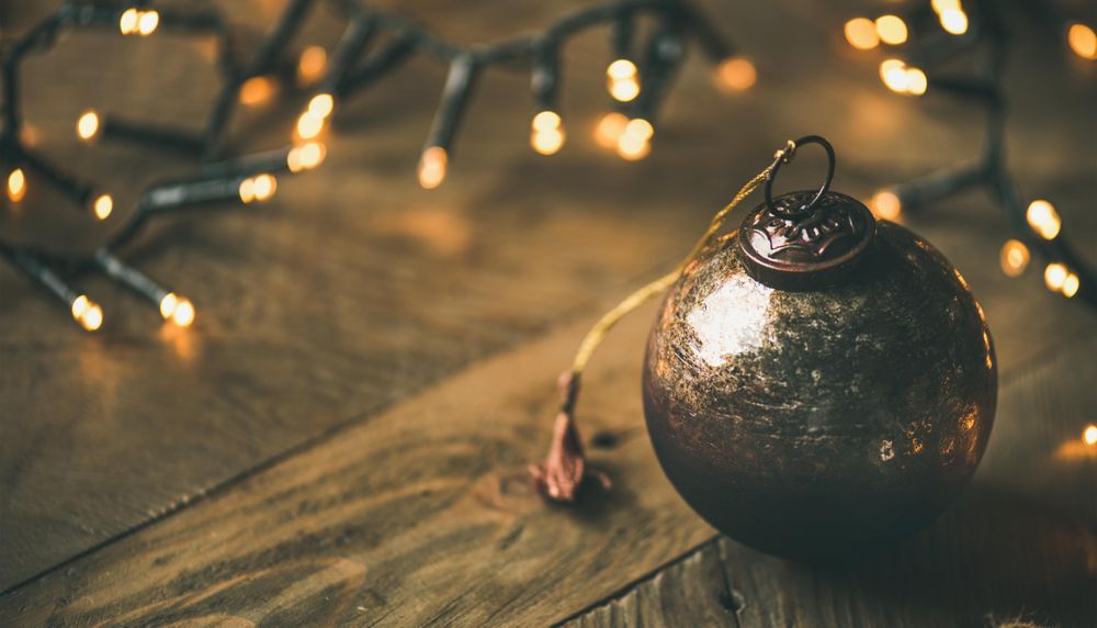 Christmas tree decorations, on wooden counter, close up, copy space