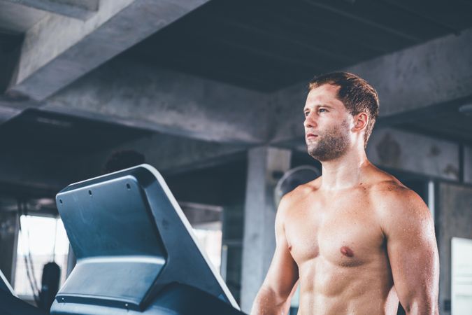 Athletic man running on treadmill