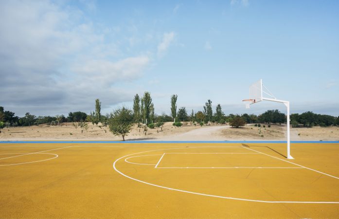 yellow basketball court outdoor.