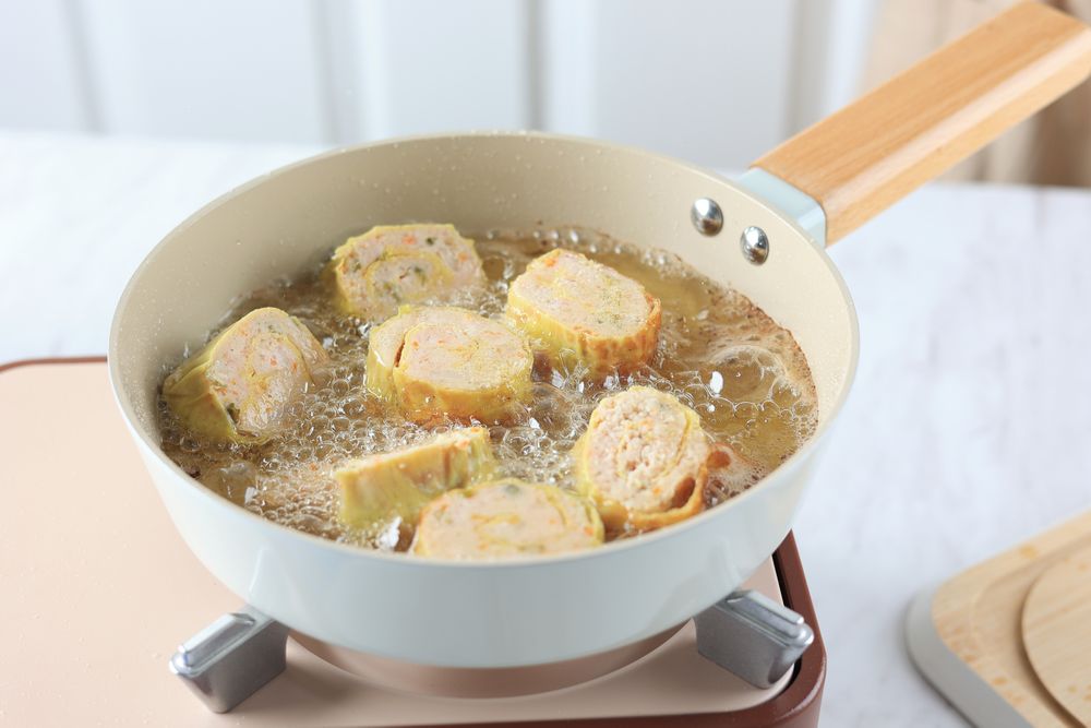 Frying Chicken Egg Roll in Hot Oil using Pan