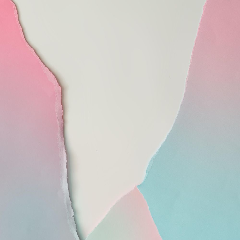 Pieces of ripped pastel colored paper in pattern