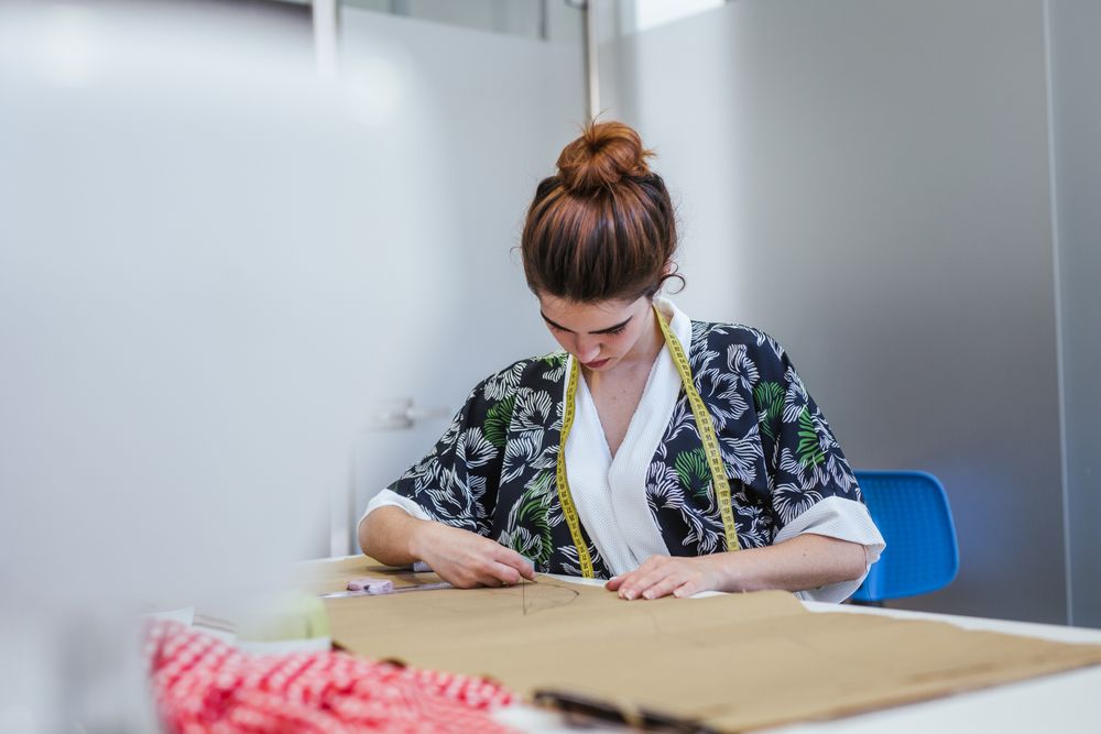 Woman in a sewing school
