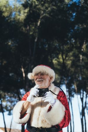 Happy Santa Claus with camera