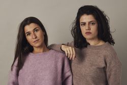 Confident female friends in studio